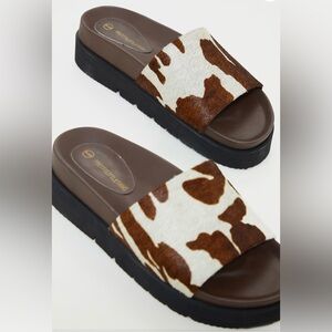 PRETTY LITTLE THING cow print platform mules